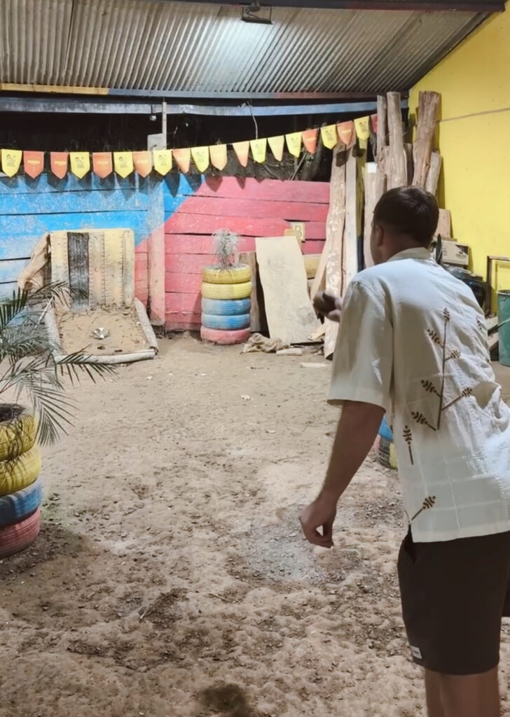 People playing Tejo, a traditional Colombian game, in Salento, Colombia