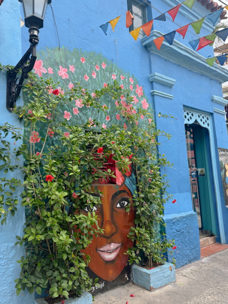 One of the best things to do in cartagena is view the colourful murals on the streets of Getsemani Cartagena