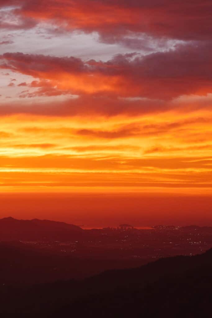Vibrant orange sunset over the mountains and jungle of Minca, Colombia
