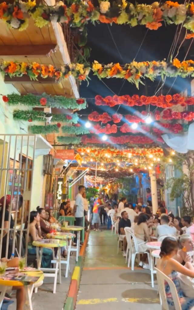 Cocktail Street in Getsemani Cartagena with people dancing and bars