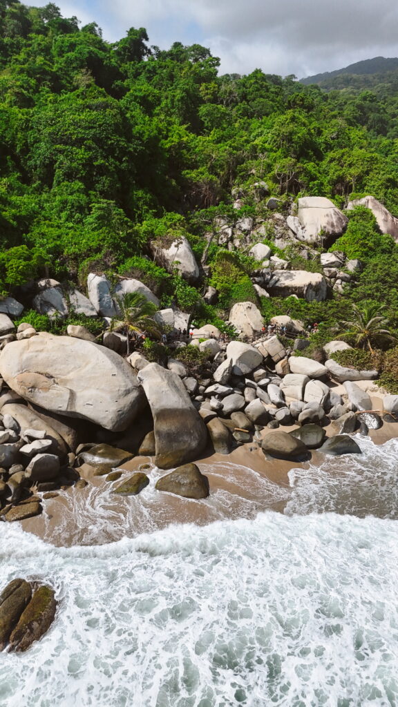 La Piscina beach in Tayrona National Park with calm turquoise water and sandy shore
