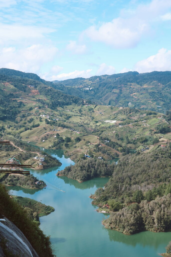 View from the summit of El Penol Rock Guatape showing blue lakes and green hills