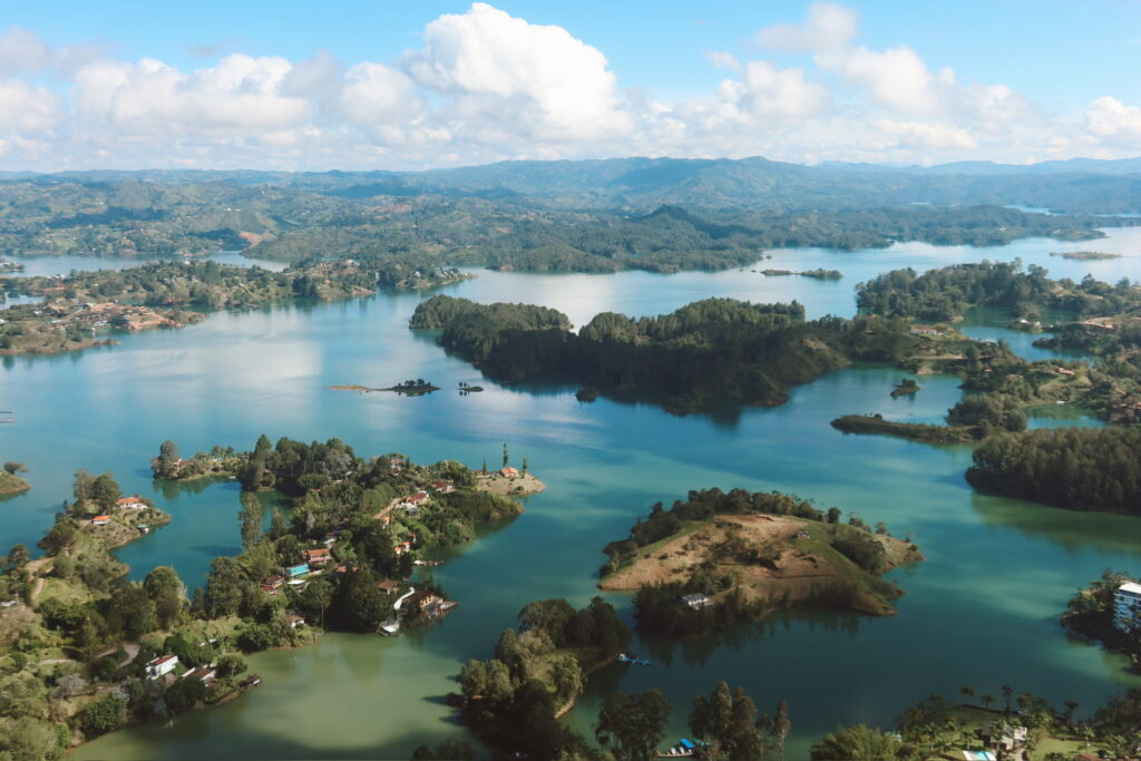View from the summit of El Penol Rock Guatape with blue lakes and green hills stretching into the distance