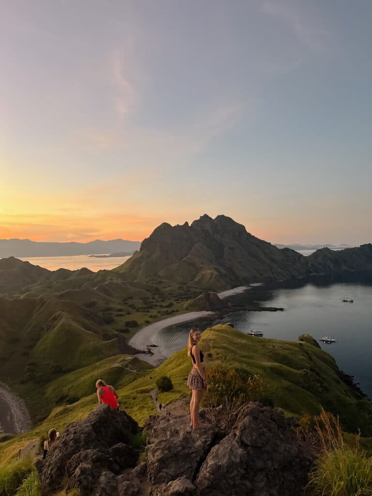 Katie, creator of Where Katie Goes, at the famous Padar Island viewpoint during a Lombok to Komodo boat trip in Indonesia.
